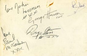 The signed back of this rare Beatles autographed photograph with both drummers Ringo Starr and Pete Best.