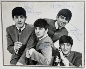 PH1. THE ULTIMATE SIGNED BEATLES PHOTOGRAPH: An Extremely Large, Rare And Desirable Dezo Hoffmann Portrait Of The Beatles - - The Most Iconic And Reproduced Beatles Image Of All Time - - Fully Signed By The Group In 1963