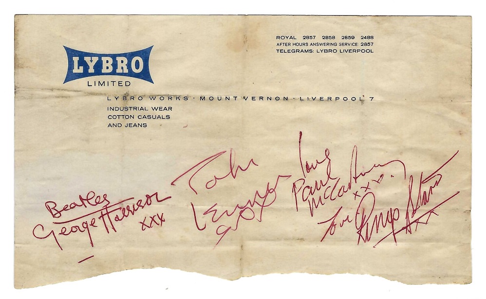 A Sheet of Lybro Jeans stationery autographed by all four Beatles in red ballpoint pen, with George Harrison adding the word "Beatles".