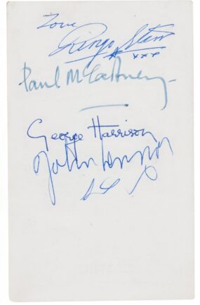 An early Parlophone promo card signed on the back by The Beatles.