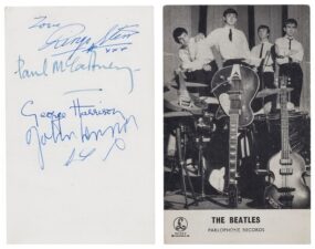 An early Parlophone promo card signed by The Beatles on the back.