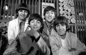 The Beatles in a smiling pose at their press conference in Toronto on August 17, 1966.